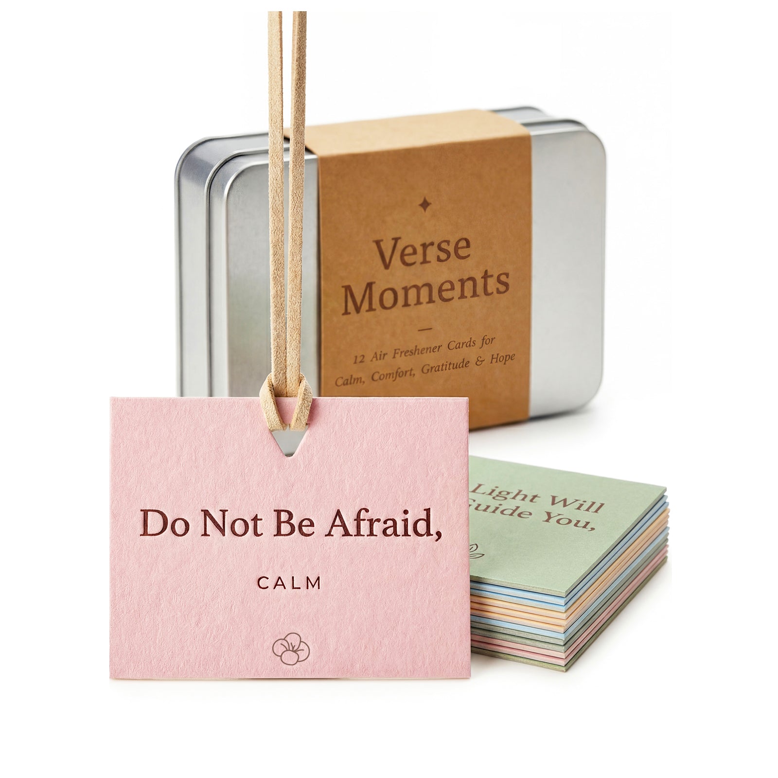 Verse Moments silver tin with a kraft paper sleeve, a pink Calm card and a stack of colored cards